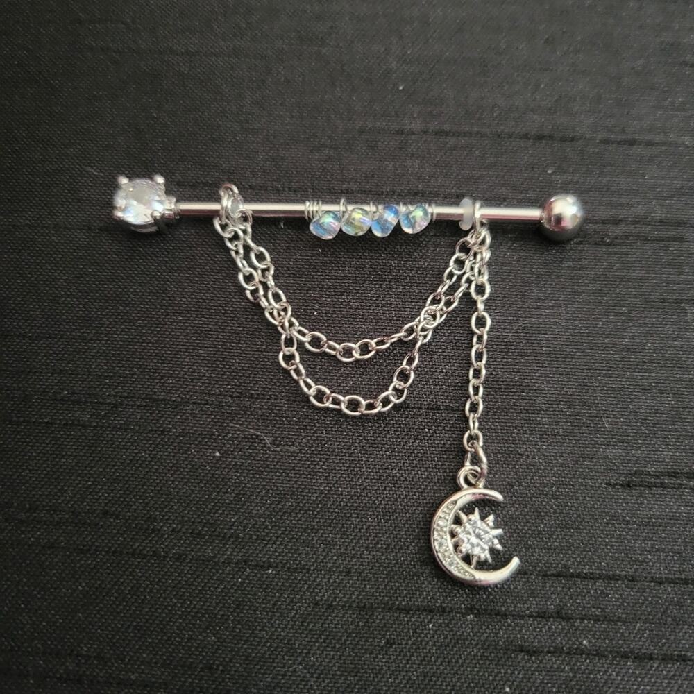 14 gauge stainless steel industrial ear piercing, beaded with crystal moon & sun